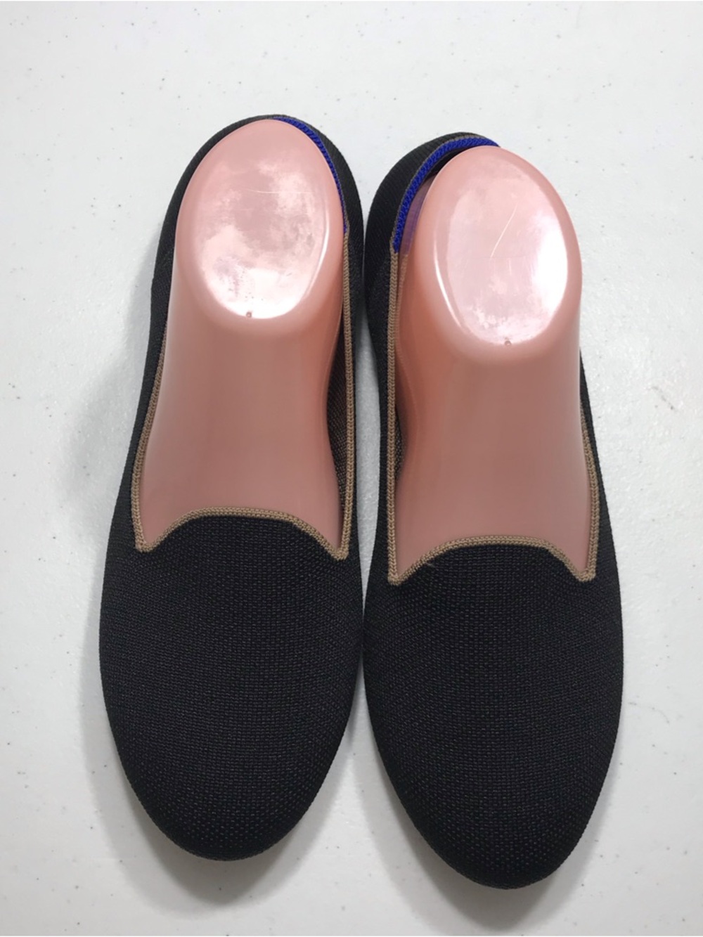 Rothy's Black Knit Slip-Ons with Tan Trim and Blue Heel Accent
